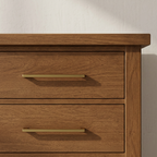Close-up of mocha dresser wood grain and drawer pull