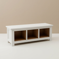 White teak storage bench with three wood-toned cubbies