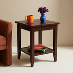 Espresso side table styled with colorful ceramics and books