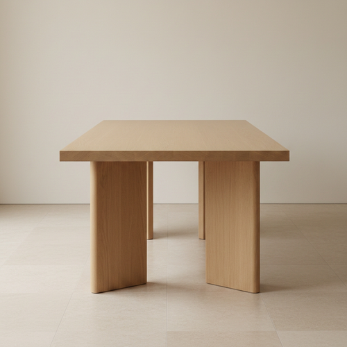 Architectural teak dining table on a beige and off-white background