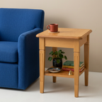 Teak side table beside blue seating with colorful accessories